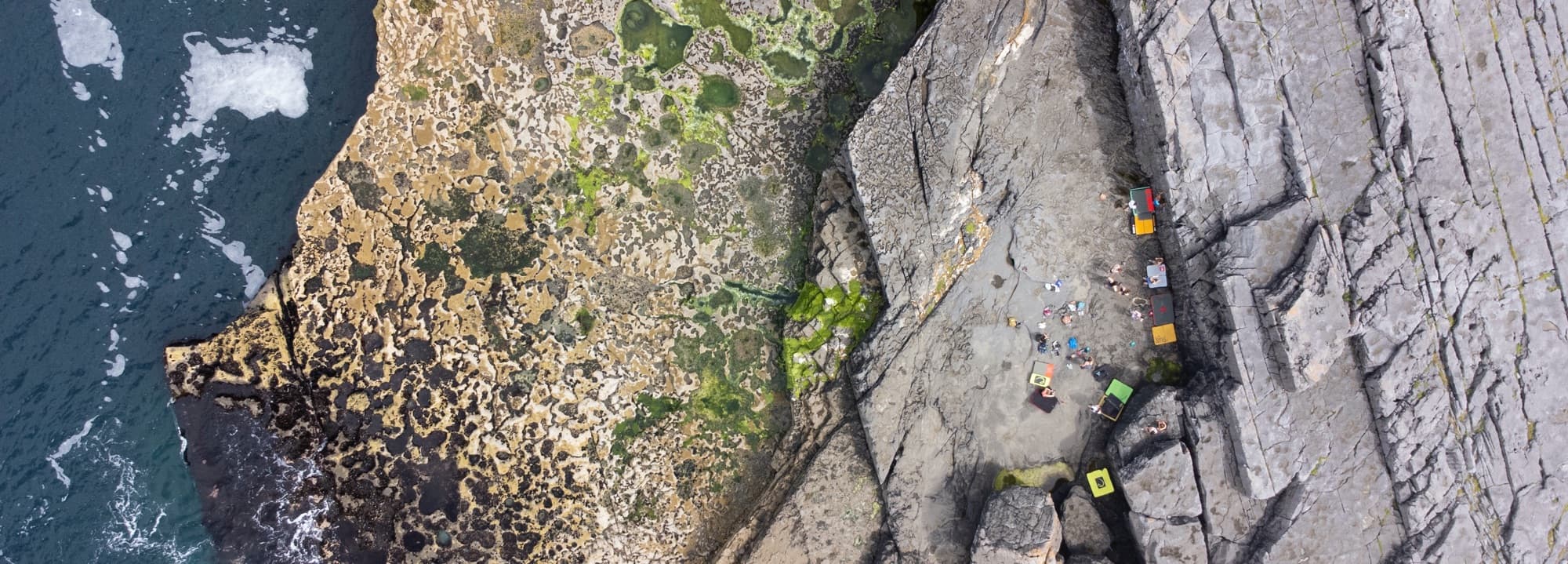 Aerial drone shot of the Doolin boulder area with female climbers