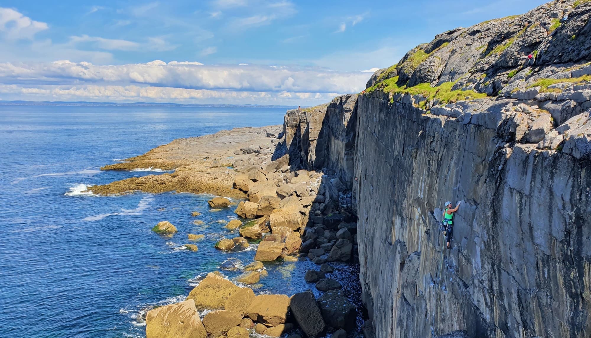 The Burren scenery with female rock climbers in the foreground